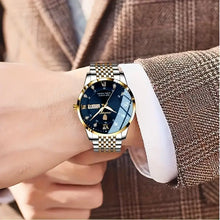 Laden Sie das Bild in den Galerie-Viewer, Herrenuhr Armbanduhr Stahl-Gold. Elegantes Design mit dunkelblauem Ziffernblatt