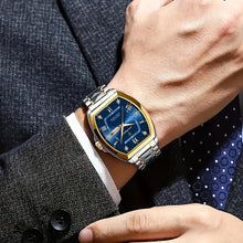 Laden Sie das Bild in den Galerie-Viewer, Elegante Uhr (Stahl/Gold  in klassischem Business‑Casual‑Stil mit markantem Tonneau‑Gehäuse